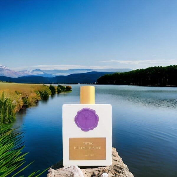 Peitho-Perfumes.ScentedCandles_ A homemade 2ml sample of Swiss molecular perfume, Prōmenade, rests on a rock by a tranquil lake.