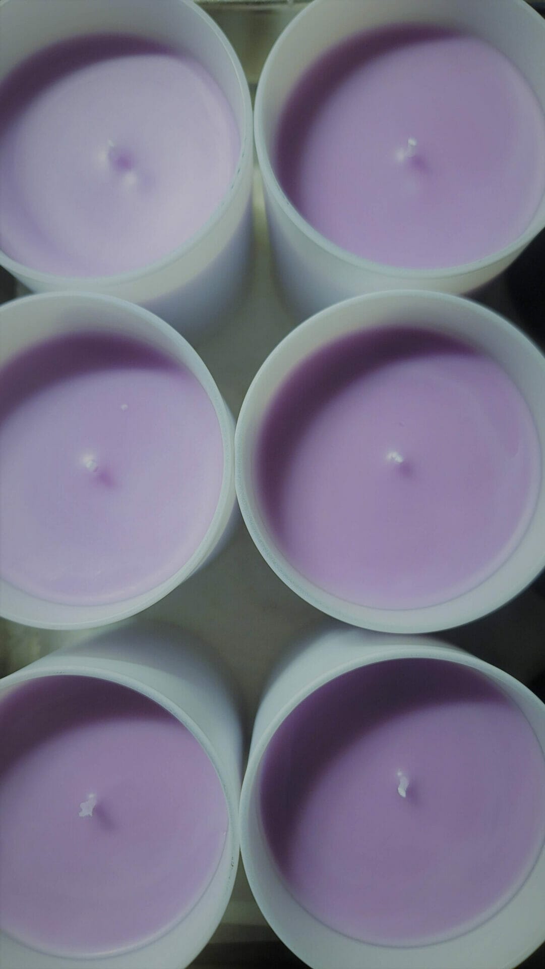 Peitho-Perfumes.ScentedCandles_ A tray of Swiss purple candles.
