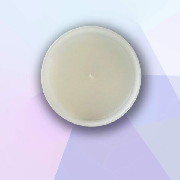 Peitho-Perfumes.ScentedCandles_ A homemade scentedcandle on a purple background.