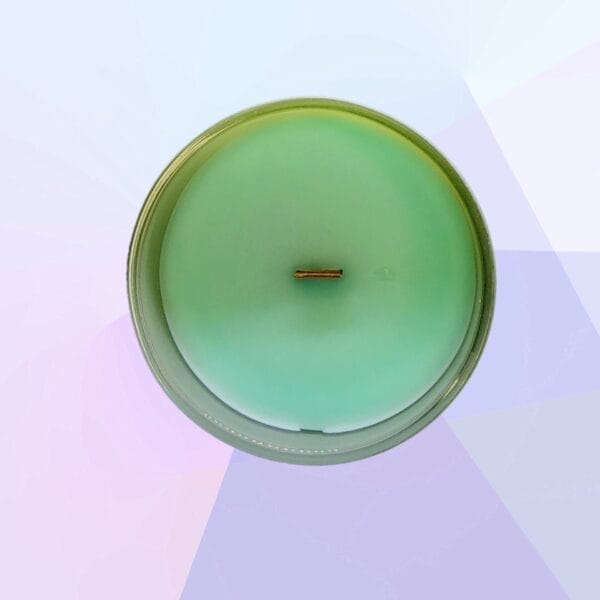 Peitho-Perfumes.ScentedCandles_ Me Time - A green scented candle on a purple background.