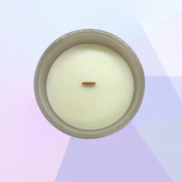 Peitho-Perfumes.ScentedCandles_ A Spa Day - Scented Candle with a wooden stick in it.